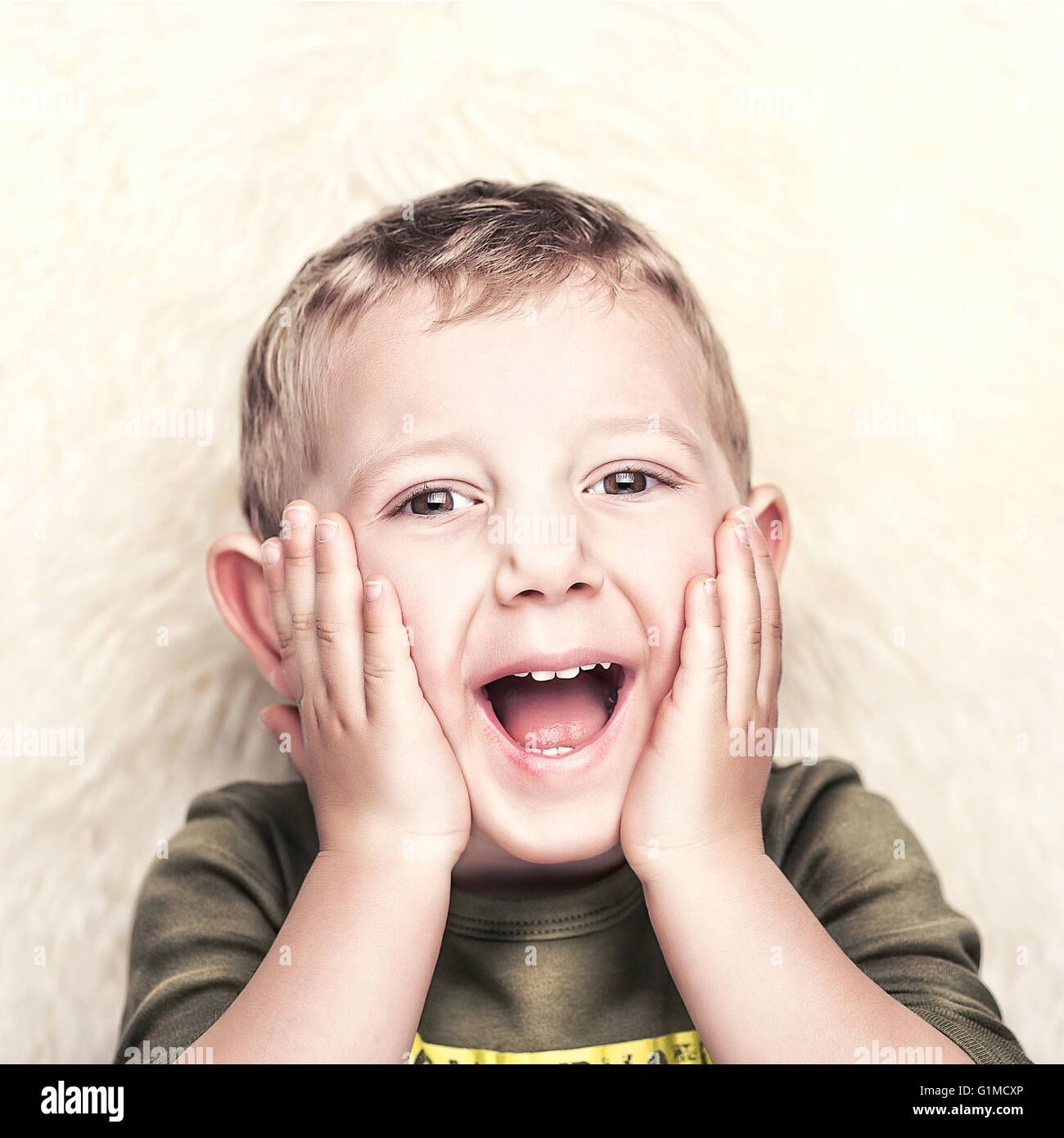 happy child portrait and fur background Stock Photo