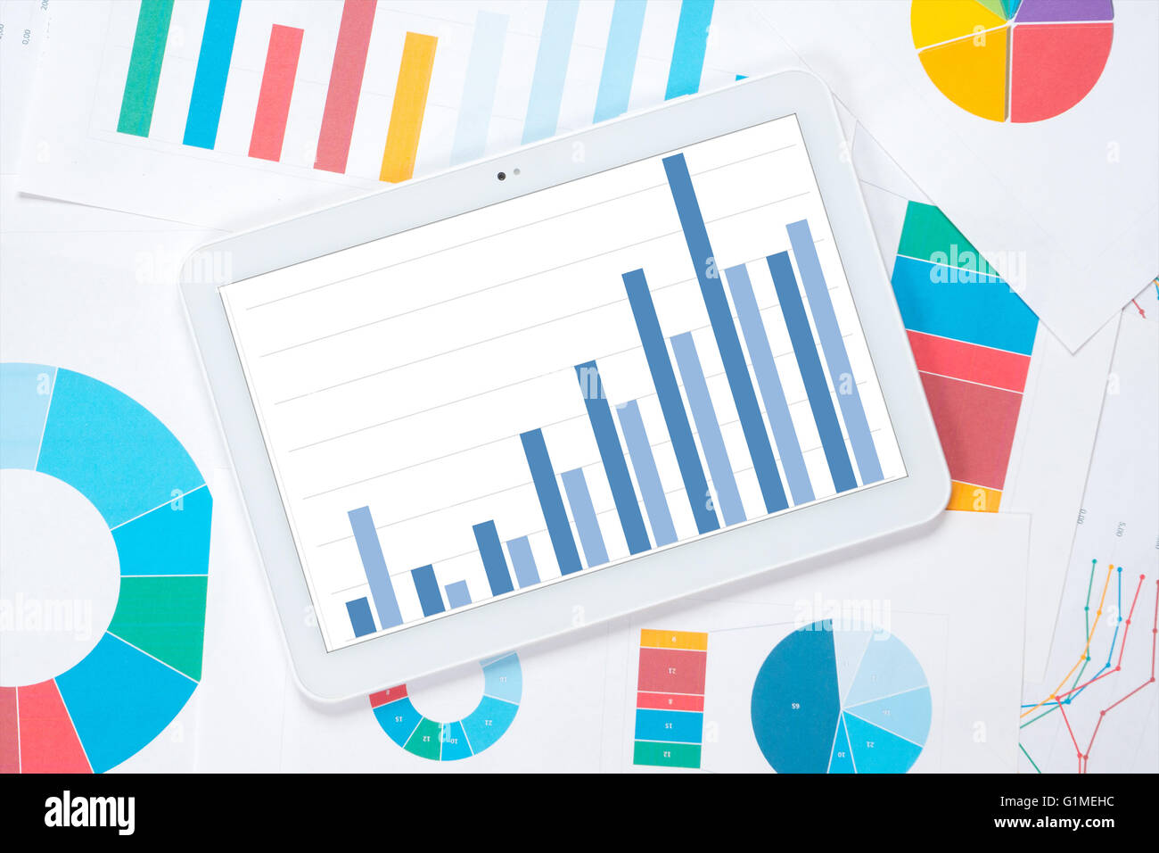 tablet chart growth trend with colorful background Stock Photo