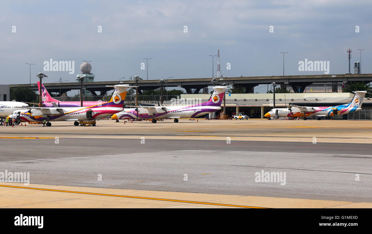 Nok Air DeHavilland Dash-8's rest at Bangkok Don Muang airport. Stock Photo