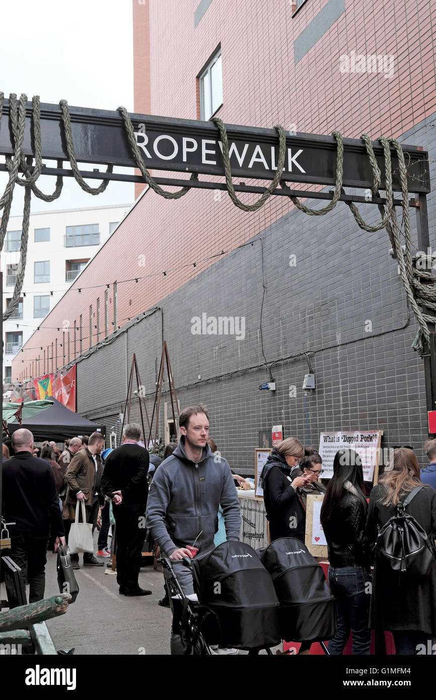People at artisan ROPEWALK street food market under the railway arches