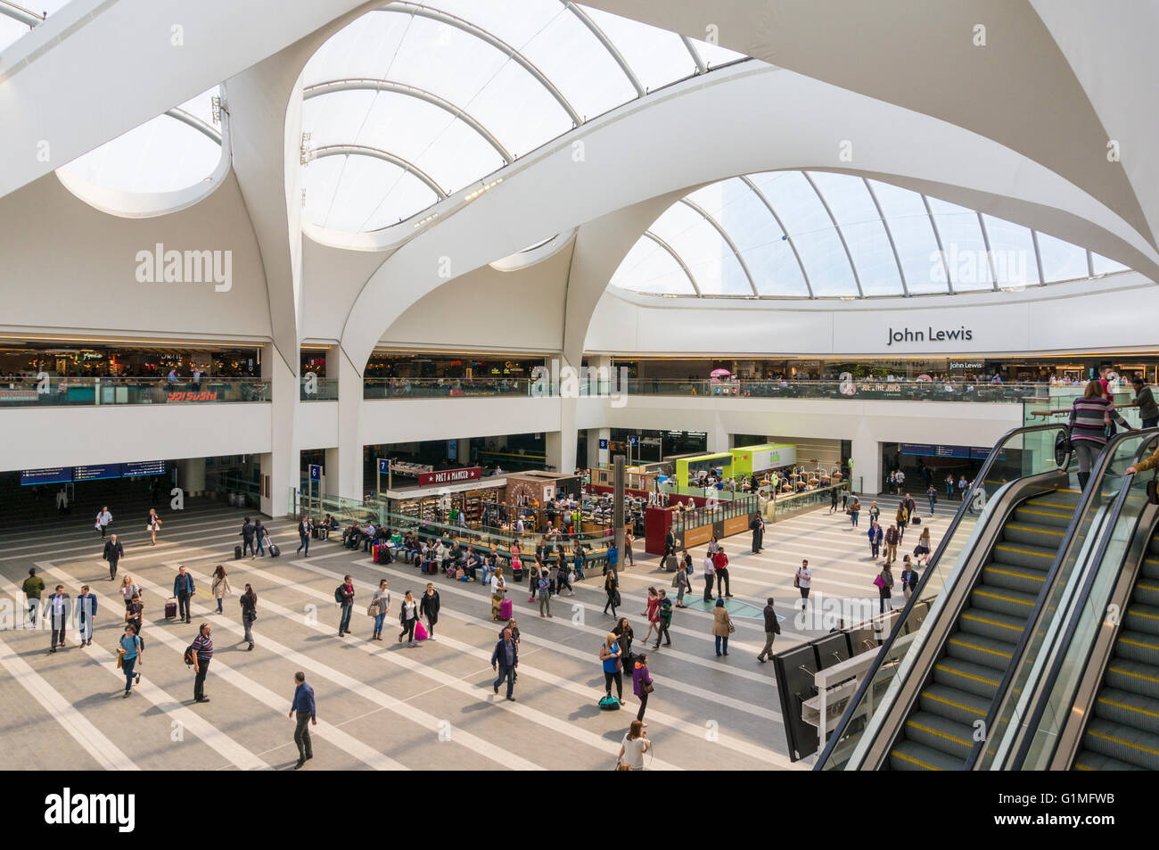 People passing through Central atrium of Birmingham new Street station Birmingham West Midlands England GB UK EU Europe Stock Photo