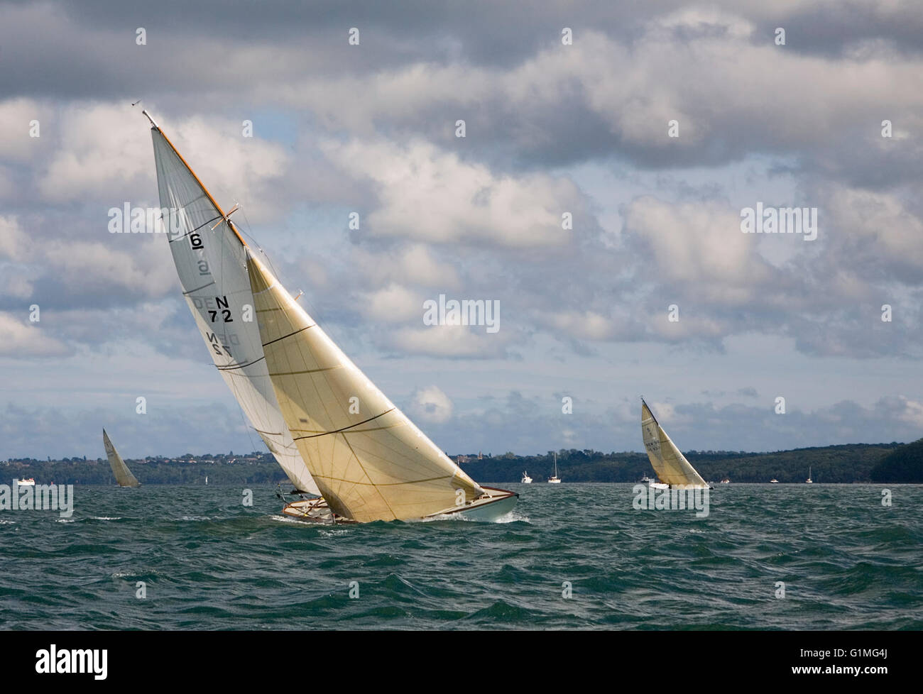 Classic International 6-Metre yachts racing off Cowes, Solent, England: 'Noreg III' in the foreground Stock Photo