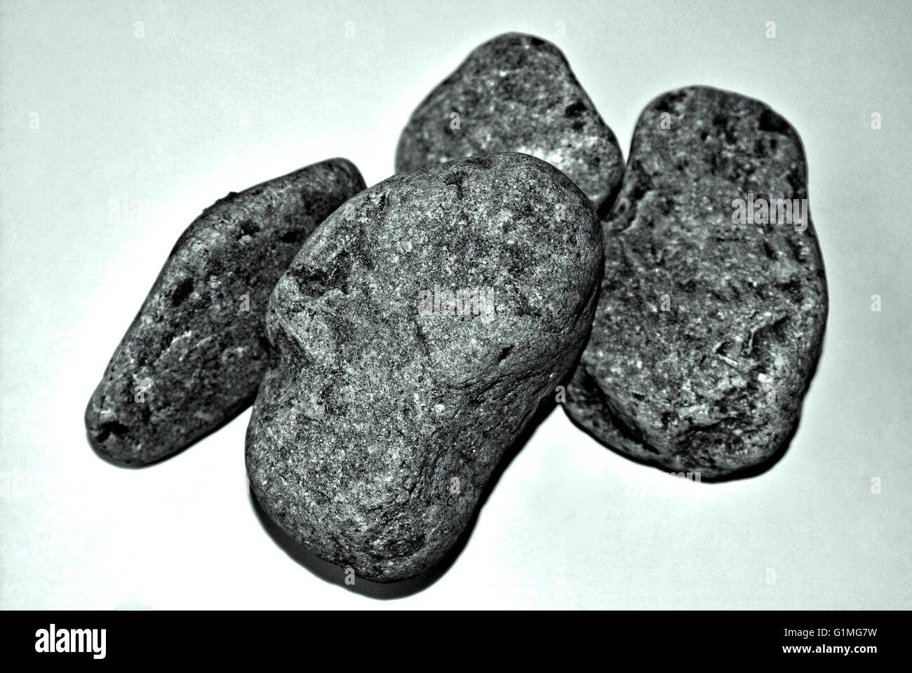 Stone arts, Arrangement four of stones, soft rounded stones in Black and White. Stock Photo