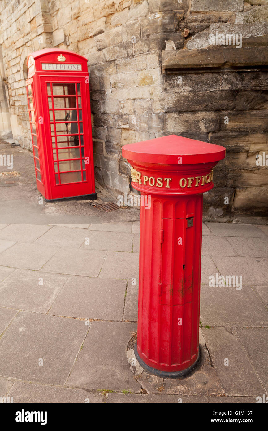 A victorian post box from 1856, and an old red telephone box at East Gate, Warwick, Warwickshire England UK (see also G1MH38) Stock Photo