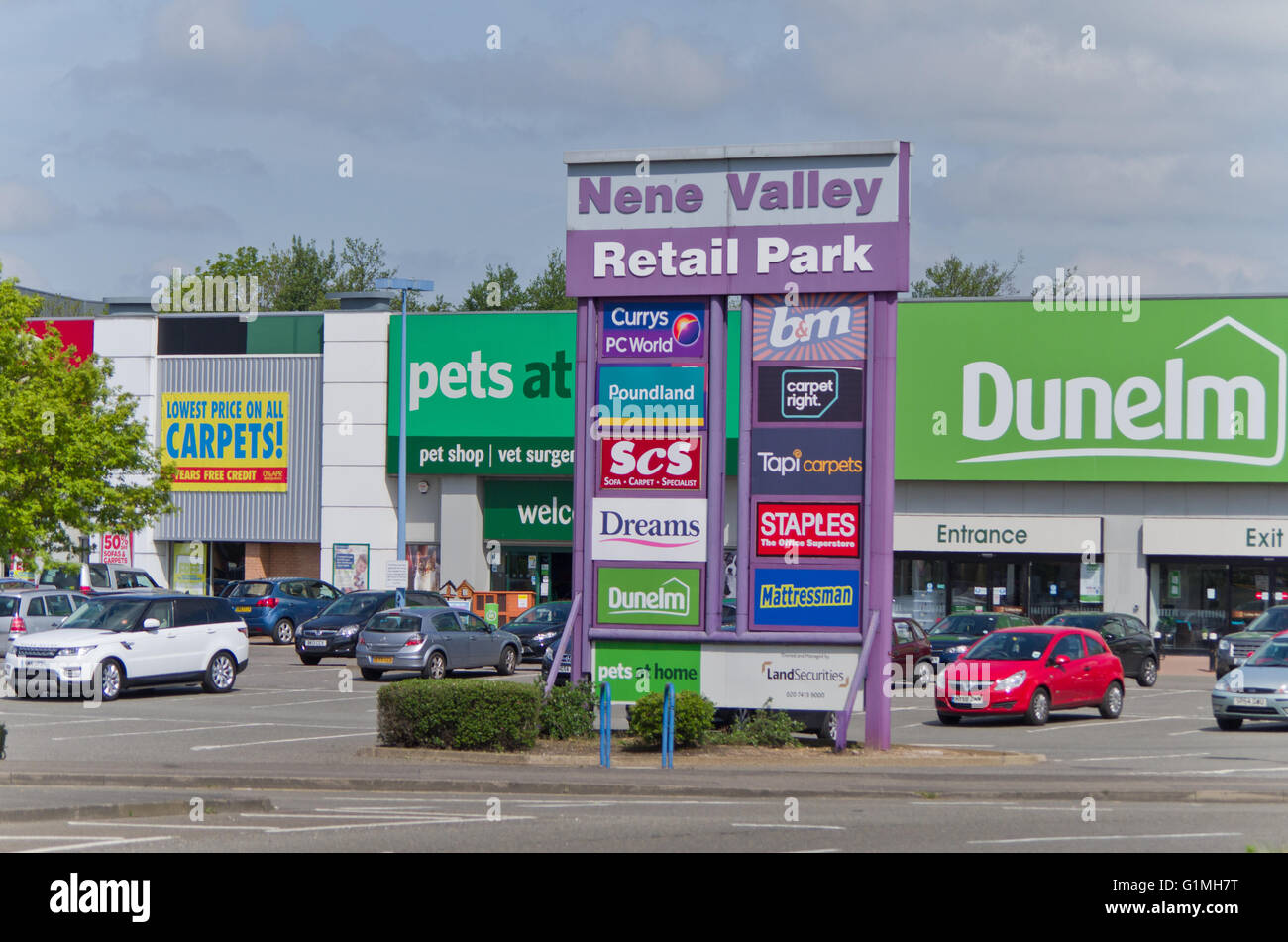 Sign listing all the shops at Nene Valley Retail Park, Northampton; some of the shops are in the background. Stock Photo