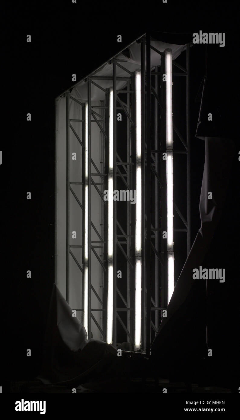 Illuminated panel ripped off showing the fluorescent tubes inside. Stock Photo