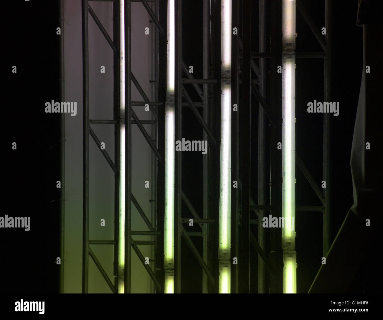 Illuminated panel ripped off showing the fluorescent tubes inside. They