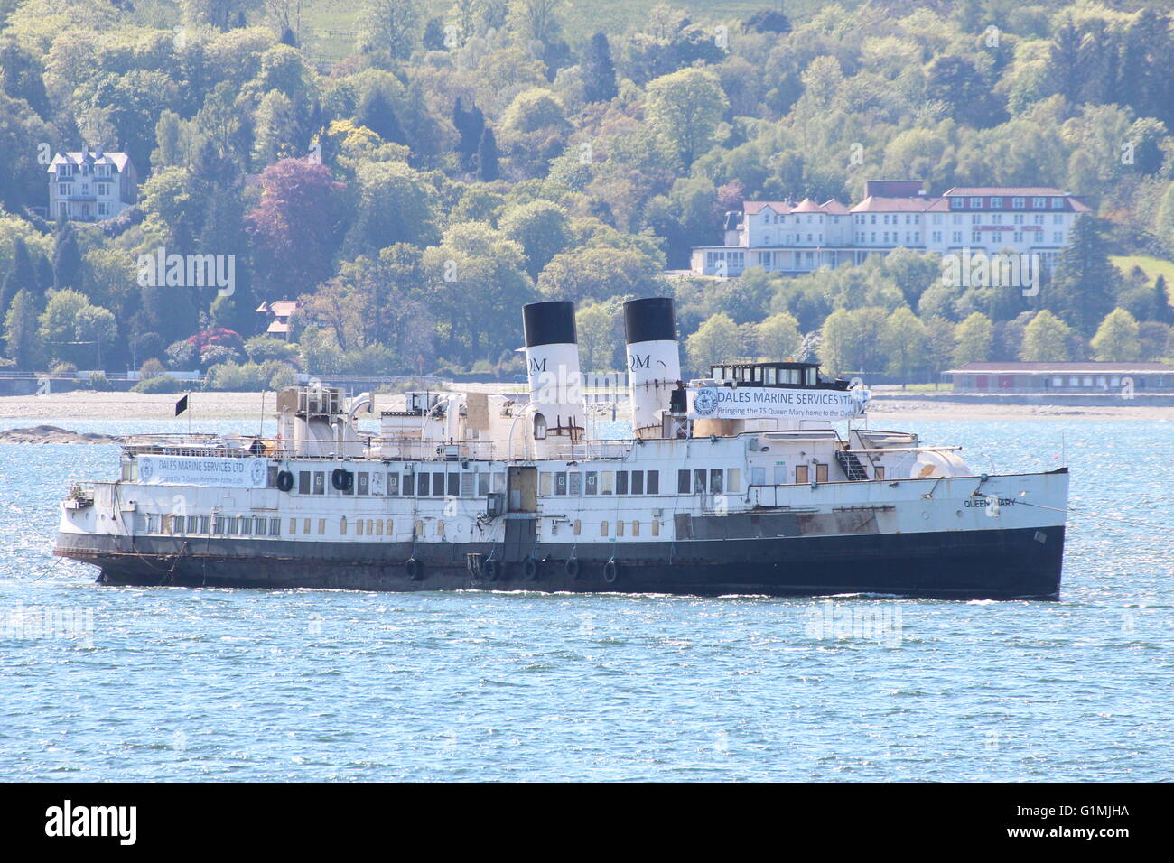 The arrival of the historic steamer the TS Queen Mary back to the Clyde, towed from Tilbury Docks by the tug Venture. Stock Photo