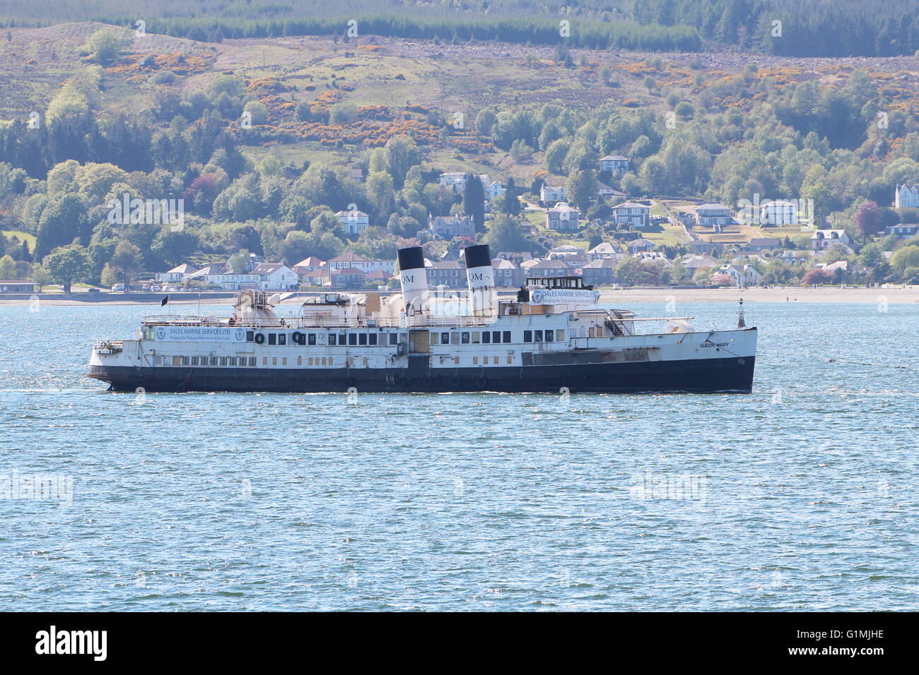The arrival of the historic steamer the TS Queen Mary back to the Clyde, towed from Tilbury Docks by the tug Venture. Stock Photo