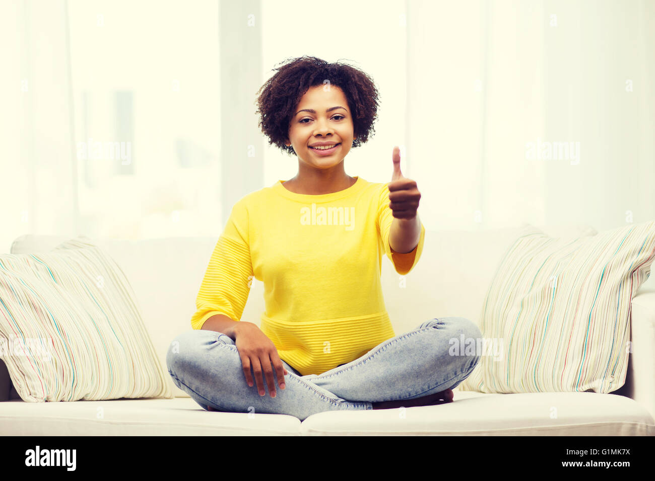 happy african american young woman at home Stock Photo - Alamy