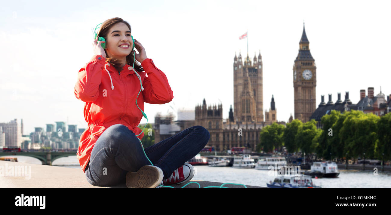 happy young woman in headphones listening to music Stock Photo