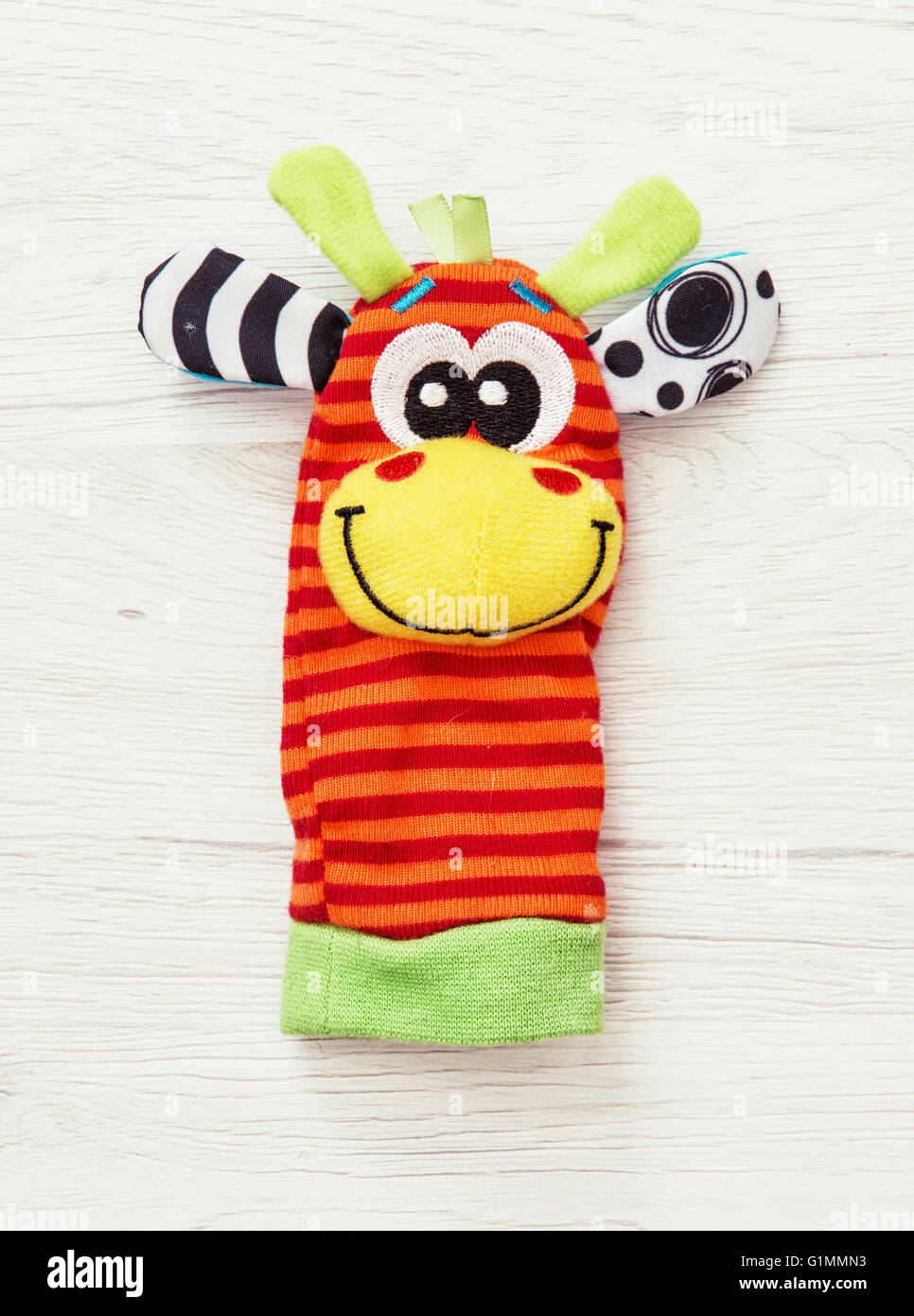 Colorful hand puppet. Funny toy. Vibrant colors. One
