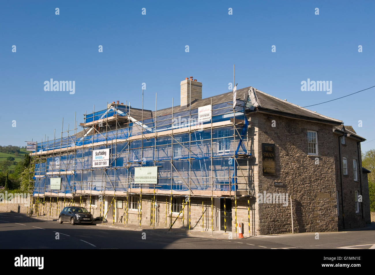 The Swan Hotel at Hay-on-Wye Powys Wales UK. A Georgian Grade II listed building covered in scaffolding while undergoing extensive refurbishment. Stock Photo