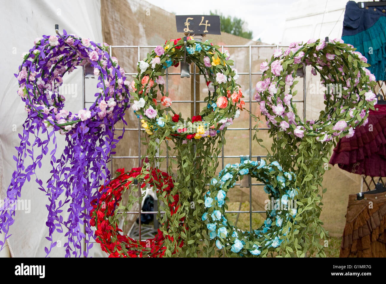 Tewkesbury, UKJuly 17, 2015 Flower wreath head garlands for sale on 17 July 2015 at Tewkesbury