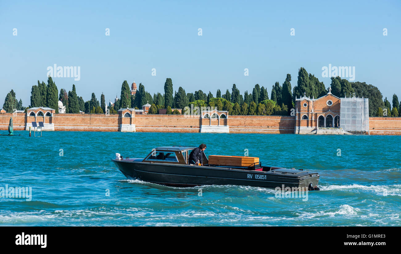 boat transporting a coffin to the cemetery on Isola di San Michele Stock Photo