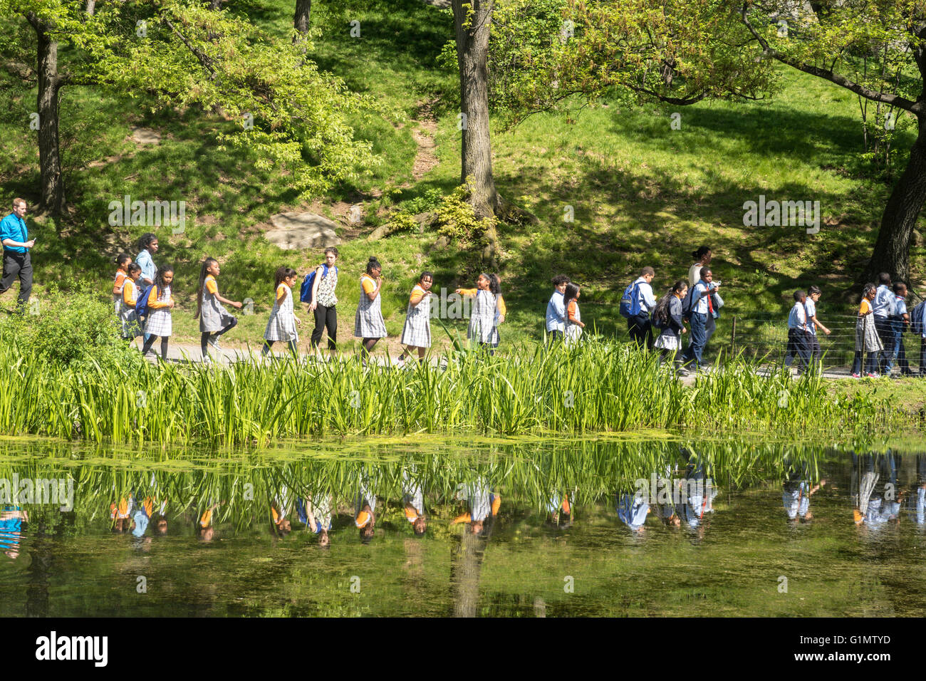 Children enjoy a field trip to The Harlem Meer in Central Park, NYC