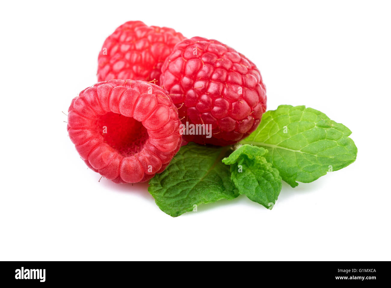 Raspberries with mint leaf closeup Stock Photo