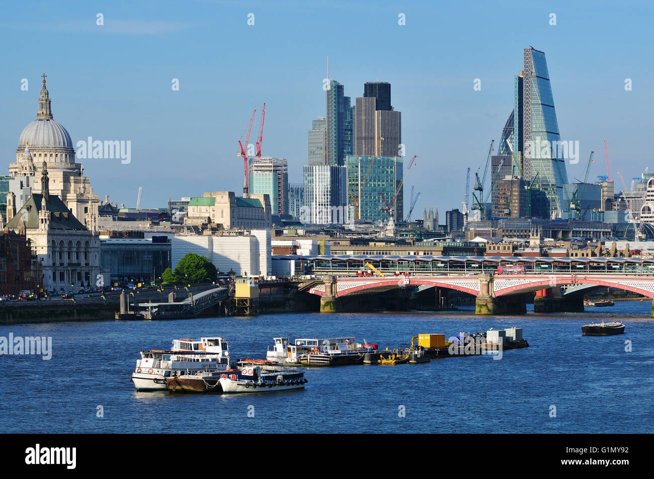 City of London skyline, UK, and the River Thames, from Waterloo Bridge, with city office buildings and St Paul's cathedral Stock Photo