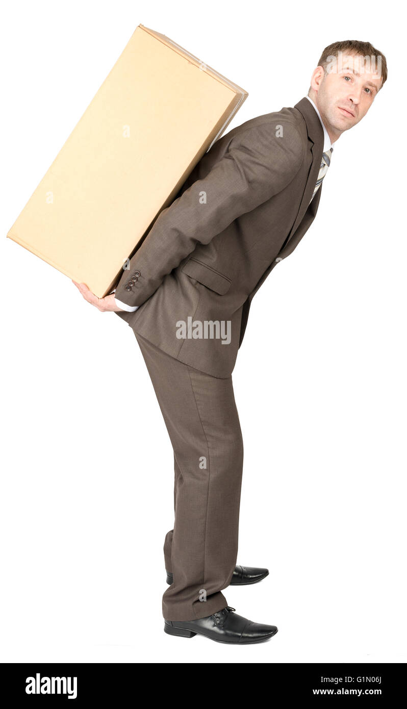 Tired businessman carrying heavy box on back Stock Photo