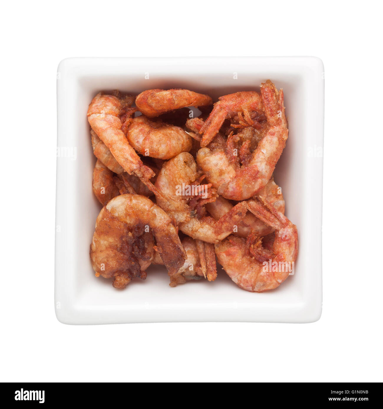 Fried shrimps in a square bowl isolated on white background Stock Photo