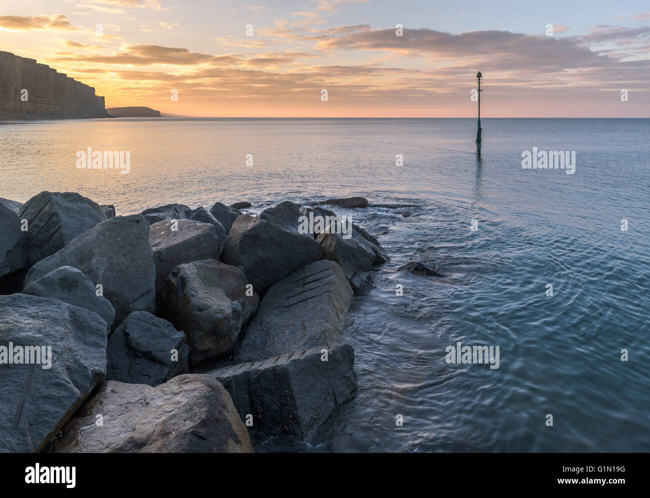 Sunrise over the ocean at Westbay Stock Photo Alamy