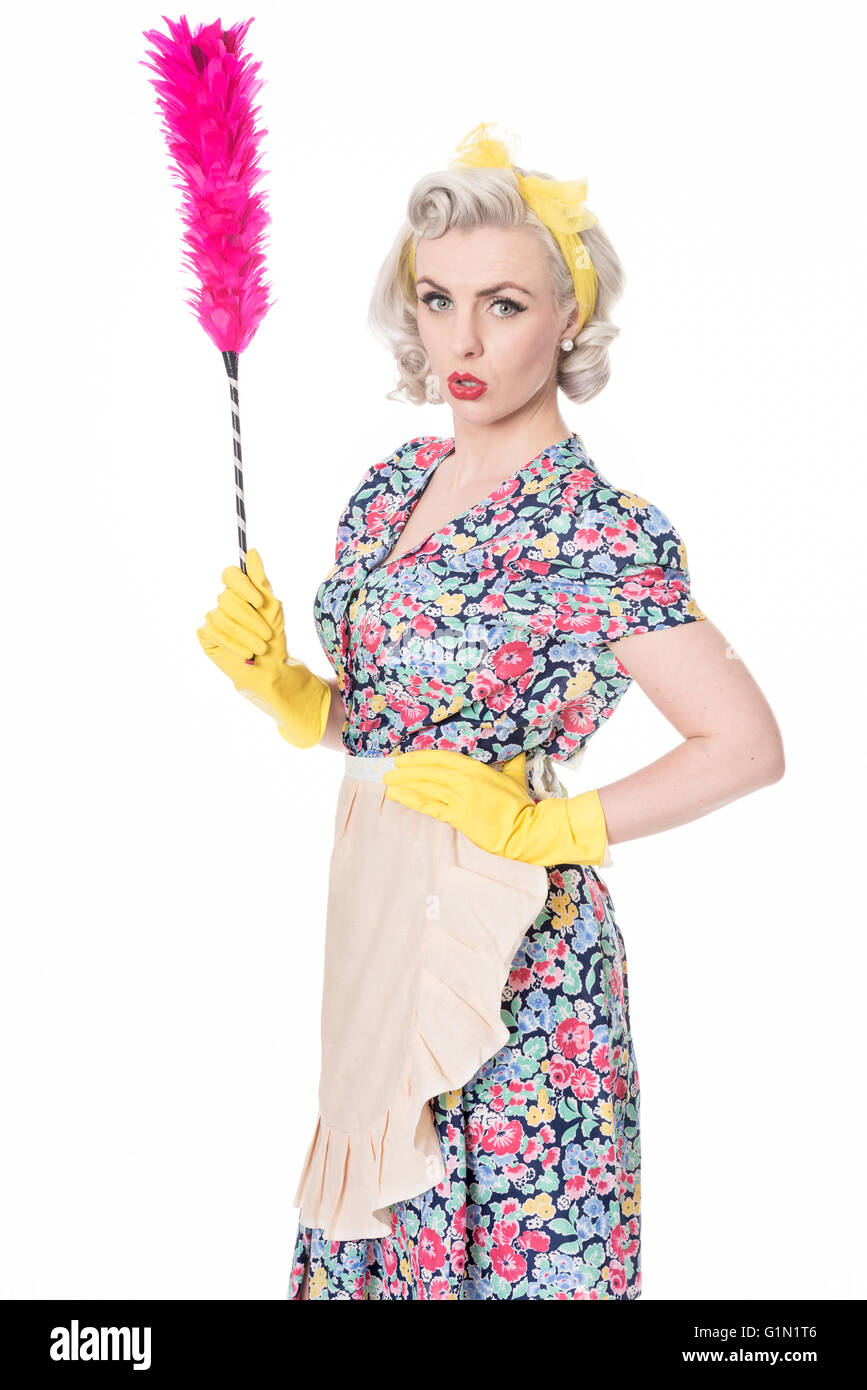 Retro housewife, with feather duster, isolated on white Stock Photo