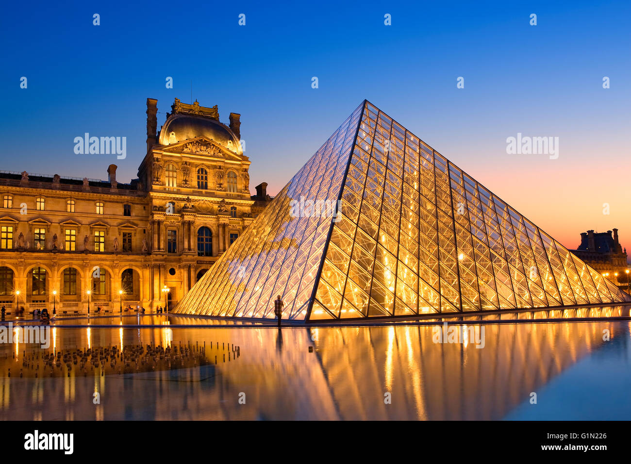 Pyramid of Louvre museum at night Stock Photo