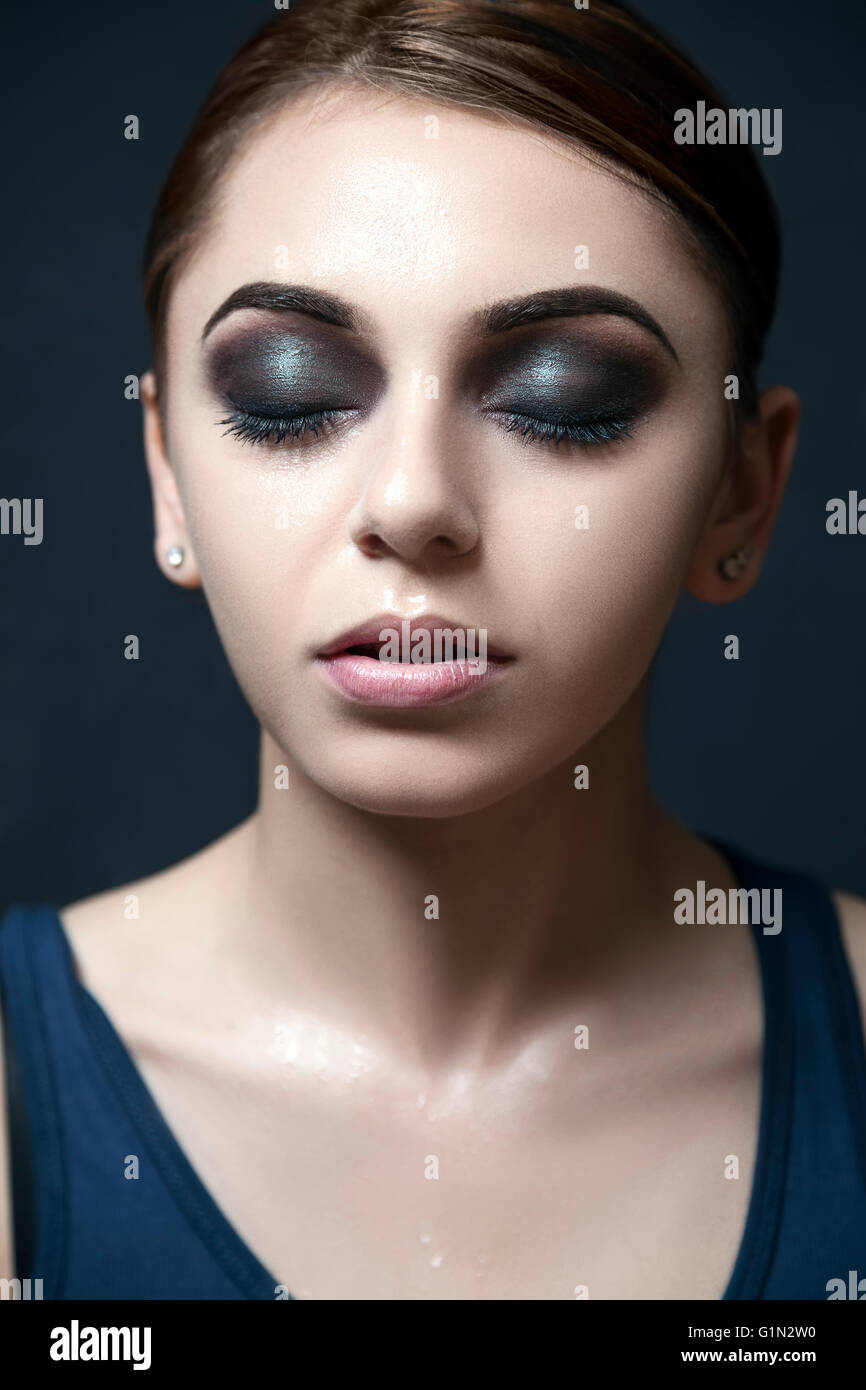 Model with dark and dramatic makeup. Stock Photo