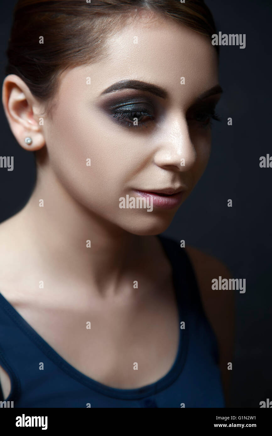 Model with dark and dramatic makeup. Stock Photo