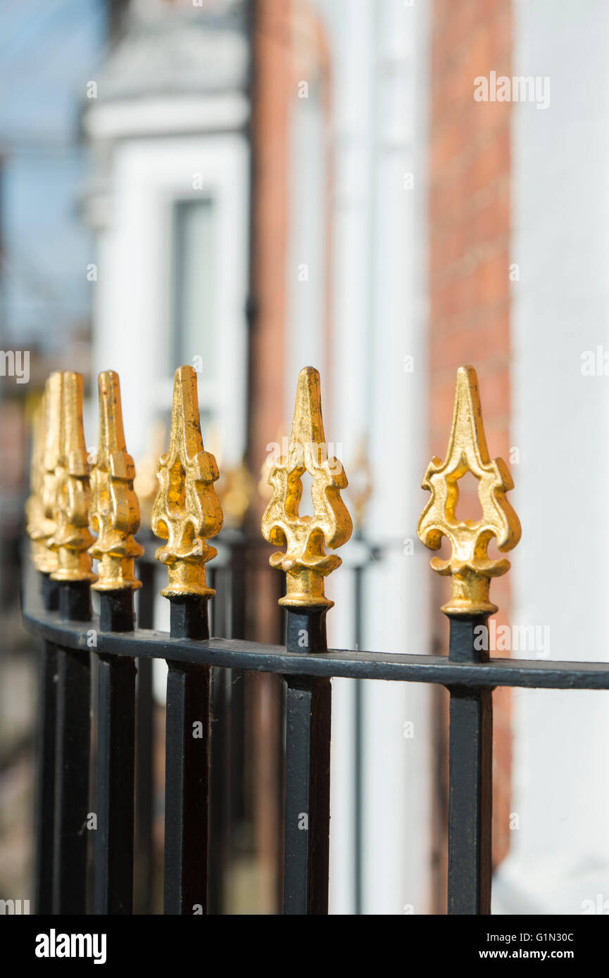 Gold painted spiked house railings in Stratford Upon Avon, Warwickshire, England Stock Photo