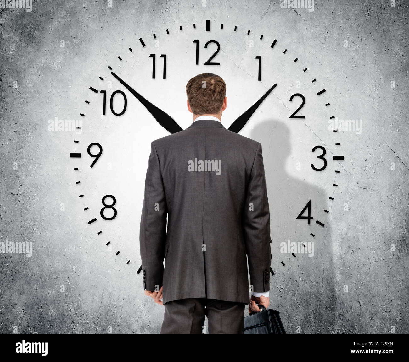 Man looking at clock Stock Photo Alamy