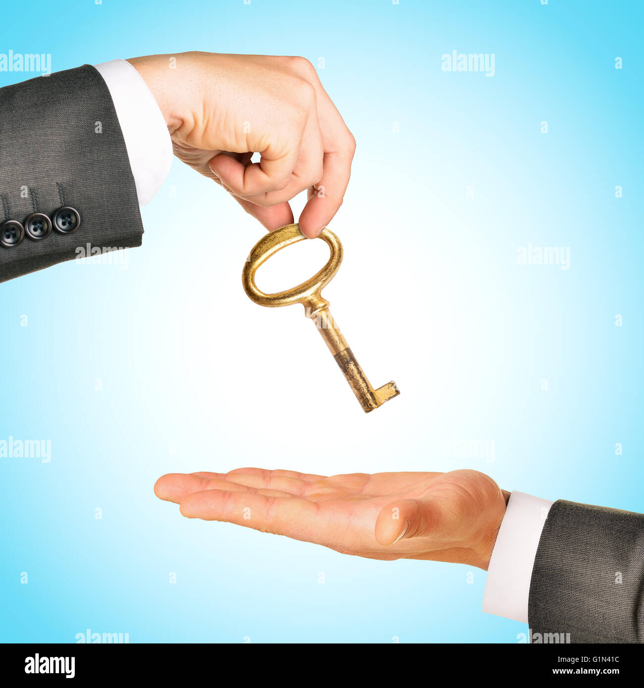 Gold key exchange Stock Photo Alamy