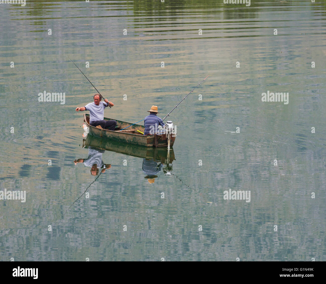 Lake Shkodra, Albania. Two men fishing from their boat.  Carp is the usual fish caught in the lake. Stock Photo