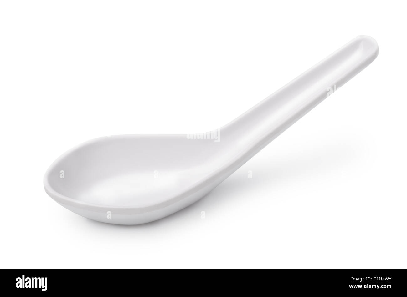 White empty ceramic soup spoon isolated on white Stock Photo
