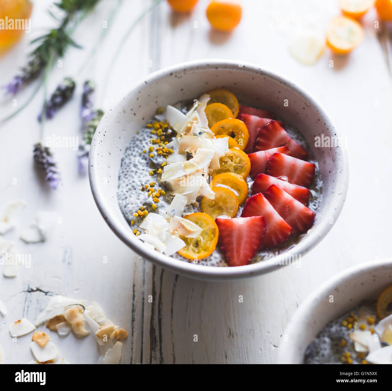 chia pudding breakfast bowls with kumquats, berries & lavender honey. Gluten-free, dairy-free. Stock Photo