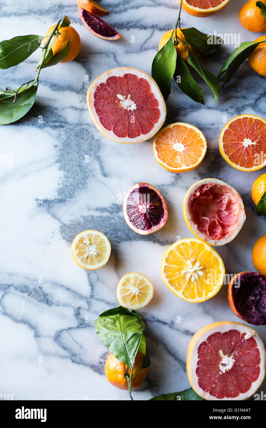 Citrus fruits. Grapefruits, lemons, and oranges on marble background. Stock Photo