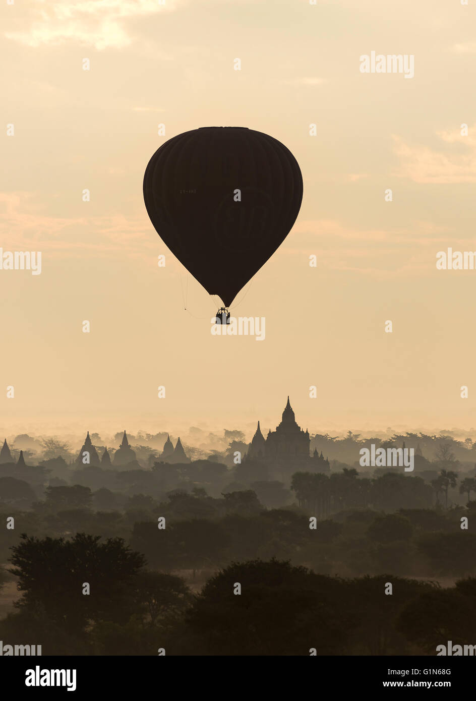 Hot-air Balloon in flight over temples of Bagan, Burma - Myanmar Stock Photo