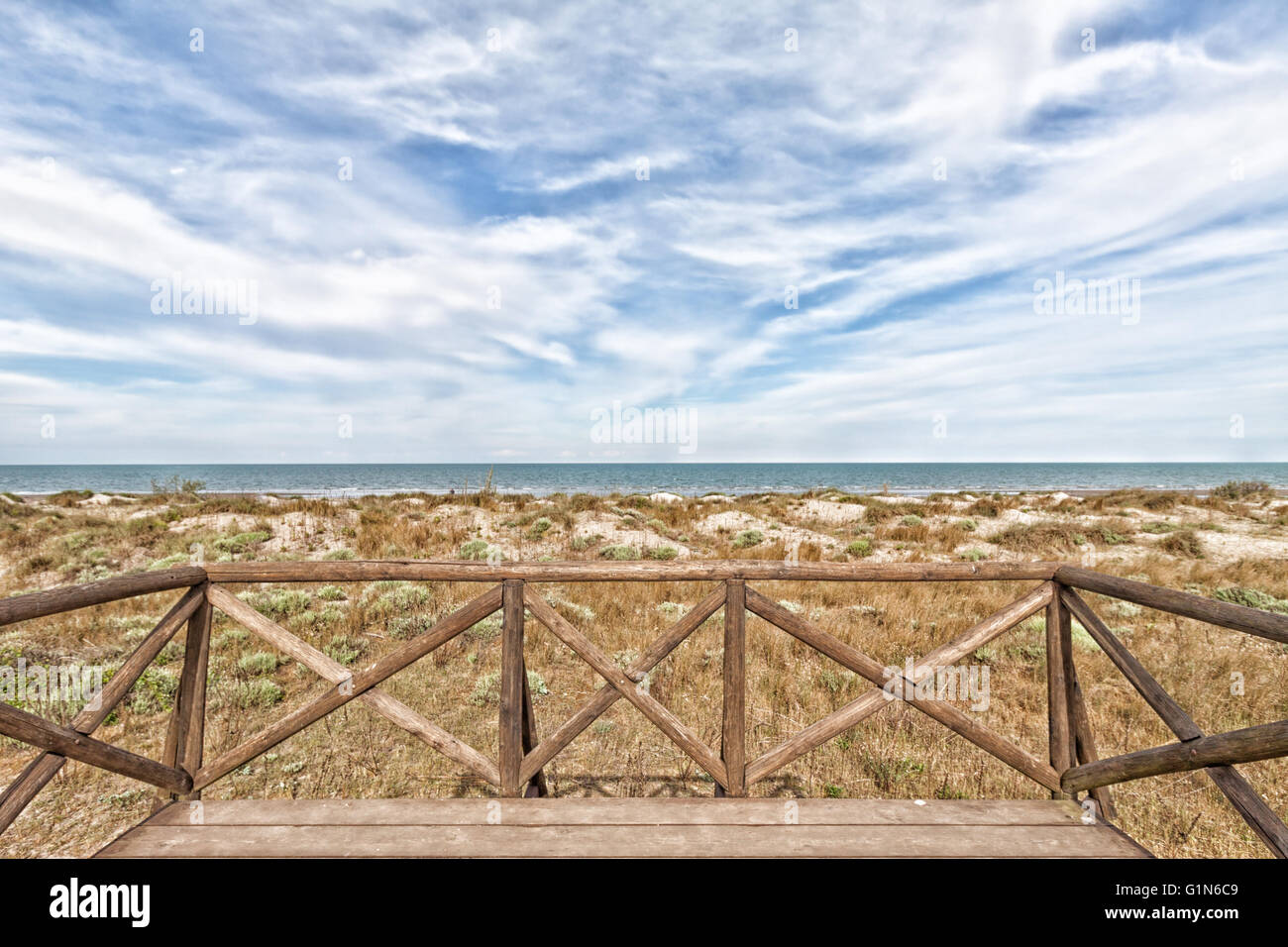 view of the beach with the sea in the distance and the cloudy sky Stock ...