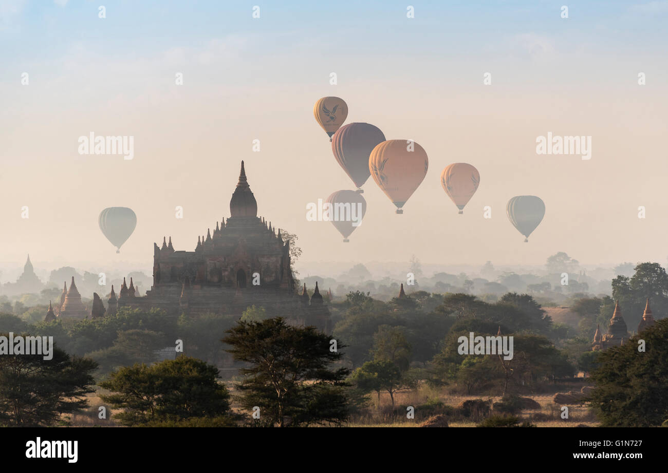 Hot-air Balloons in flight over temples of Bagan, Burma - Myanmar Stock Photo