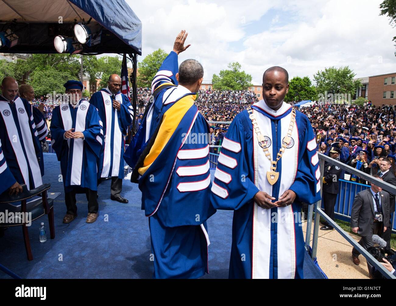 U.S President Barack Obama departs the stage with Dr. Wayne Frederick, Howard University President, after delivering the commencement address during the class of 2016 graduation ceremony at Howard University May 7, 2016 in Washington, D.C. Stock Photo