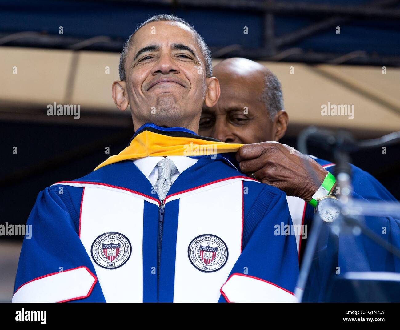 U.S President Barack Obama is presented with a Doctor of Laws honorary degree with help from Vernon Jordan during the Howard University class of 2016 graduation ceremony at Howard University May 7, 2016 in Washington, D.C. Stock Photo