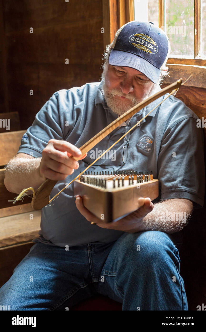 Great Smoky Mountains National Park, Tennessee - Charlie Closz plays his psaltery in Cades Cove Primitive Baptist Church. Stock Photo