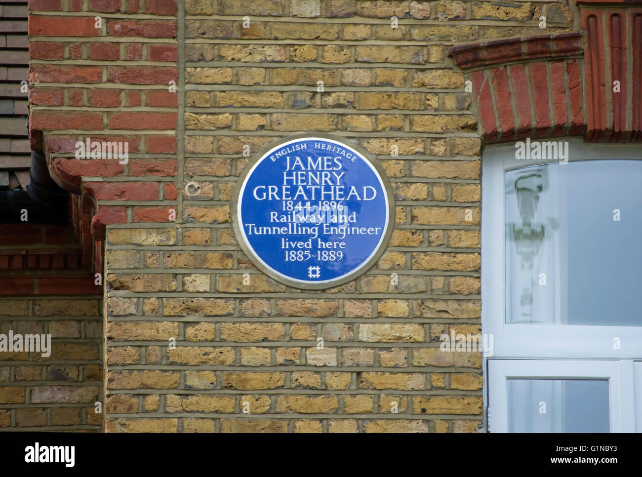 english heritage blue plaque marking  a home of railway and tunnel engineer, james henry greathead, putney, london, england Stock Photo