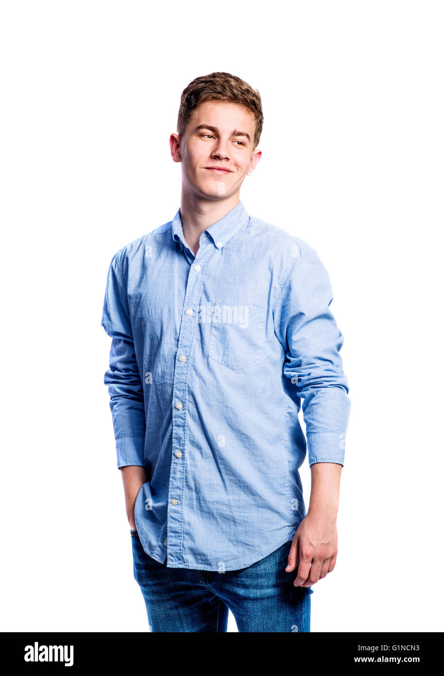 Boy in jeans and tshirt, young man, studio shot Stock Photo Alamy