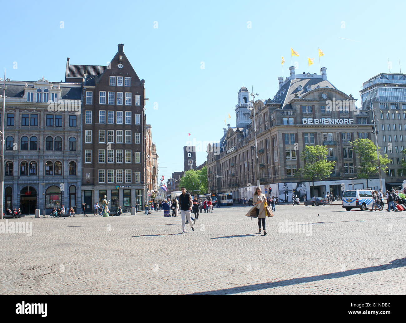 Amsterdam Dam square looking towards Central Station. De Bijenkorf  department store / flag ship store in  Amsterdam Stock Photo