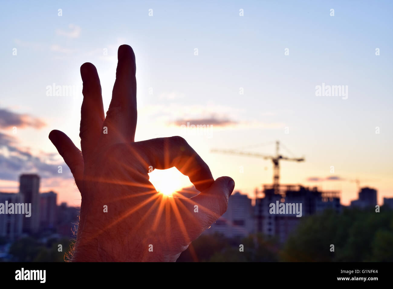 Everything will be fine -   the sun inside the ok gesture Stock Photo