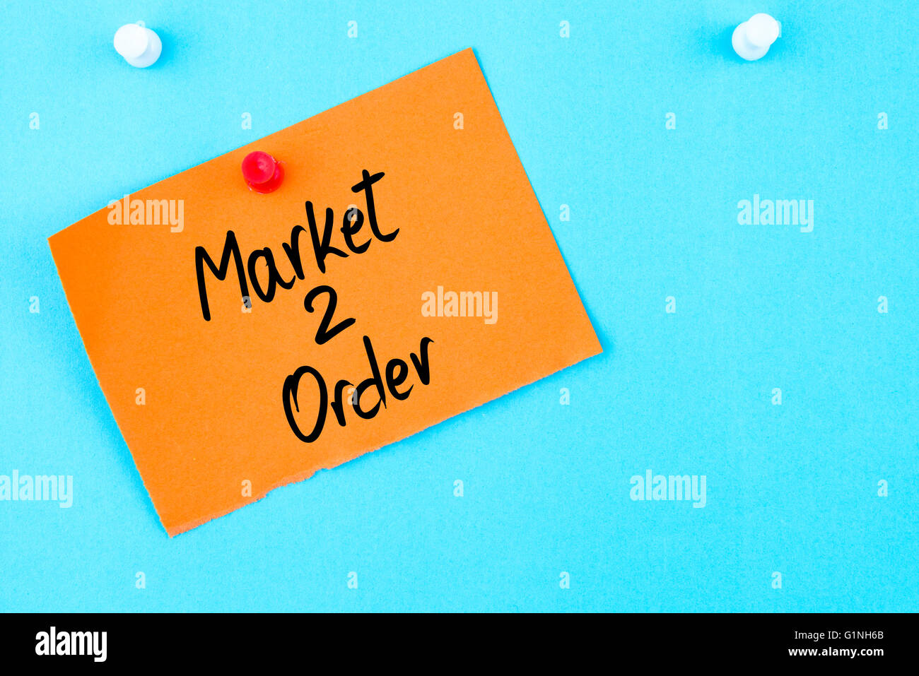 Market To Order written on orange paper note pinned on cork board with ...