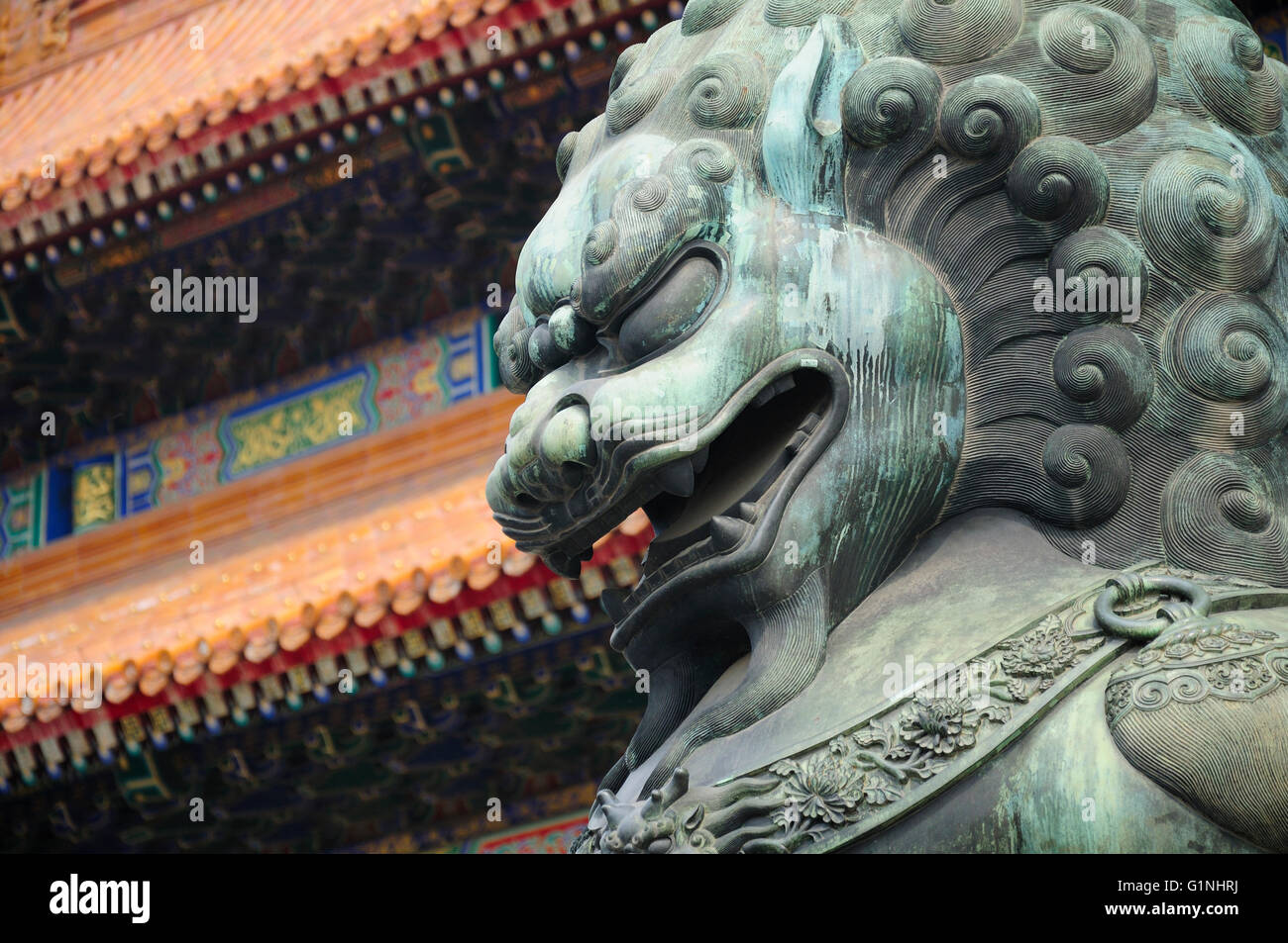 A metal chinese lion statue within the forbidden city in front of the Gate of Supreme harmony (tianhe men) in Beijing China. Stock Photo