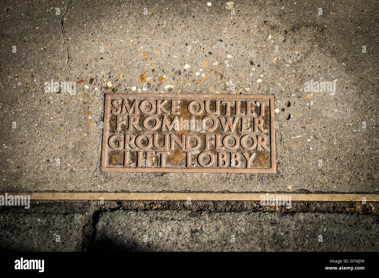 smoke outlet from lower ground floor lift lobby brass plaque on