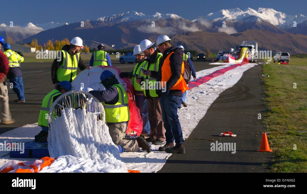 Wanaka, New Zealand. 17th May, 2016. NASA technicians begin inflating the super pressure balloon at Wanaka Aerodrome May 17, 2016 in Wanaka, New Zealand. Carried by the wind the balloon is expected to circumnavigate the globe in the southern hemispheres stratosphere providing inexpensive access to near-space research. Credit:  Planetpix/Alamy Live News Stock Photo